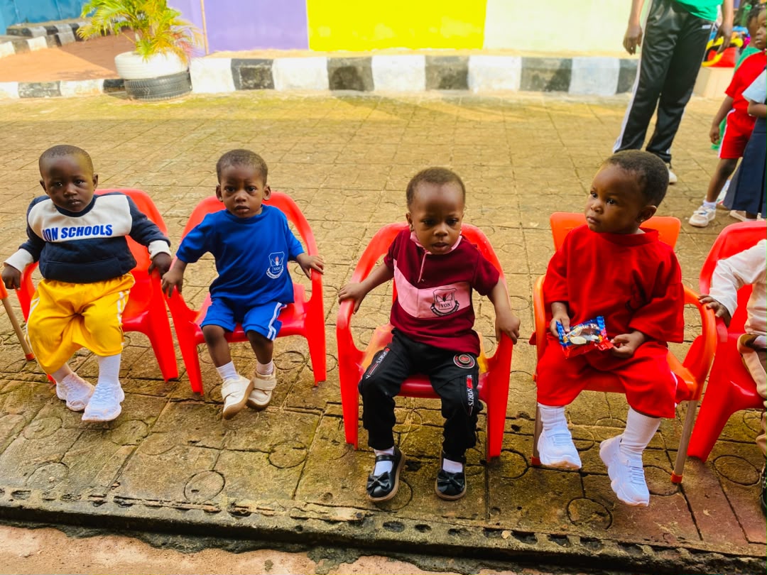 Vonschools nursery pupils seated at a school event